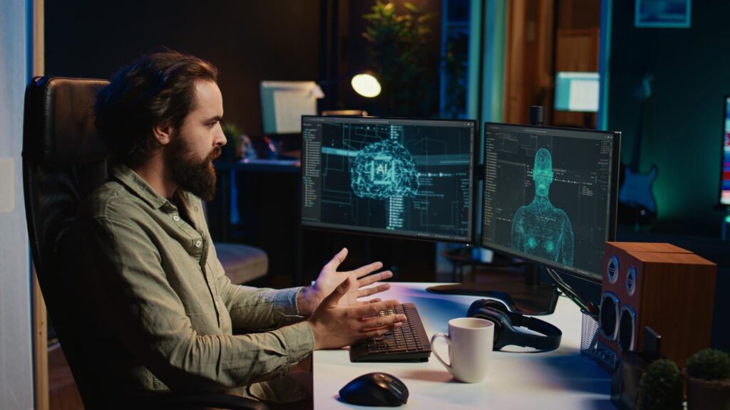 An engineer presenting system architecture to a team in a meeting room