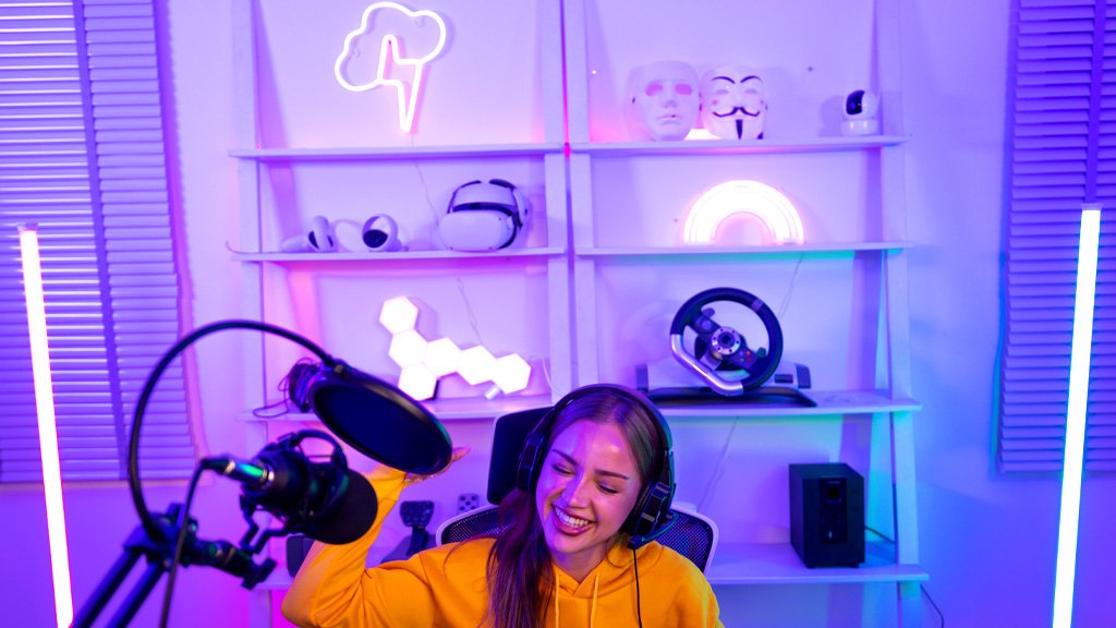 Enthusiastic lady gamer with neon signs on shelf