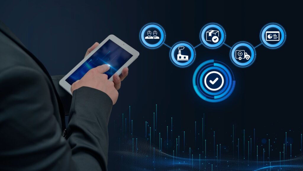 Person holding tablet displaying digital interface with interconnected icons for teamwork, quality assurance, delivery
