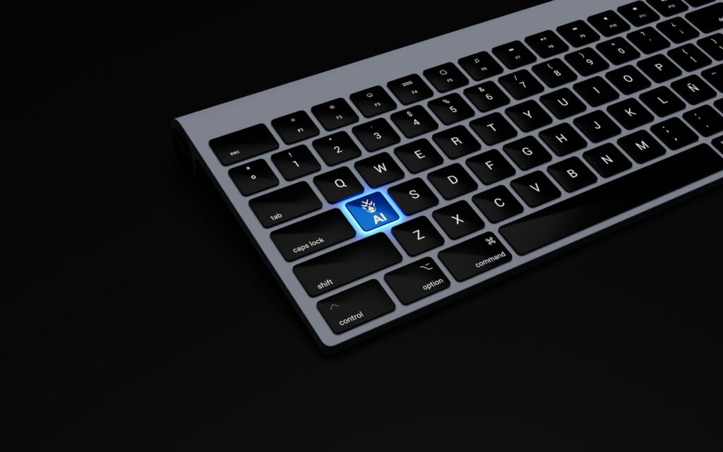 A glowing blue AI key with a hand icon stands out among black keys on a laptop keyboard against a dark background.