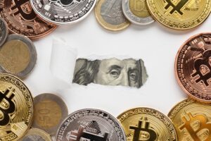 Crypto’s Summer Rebound Masks a Deeper Industry Shakeout. What Investors Should Know Engraved portrait of a historical figure visible through torn white paper, surrounded by cryptocurrency and traditional currency
